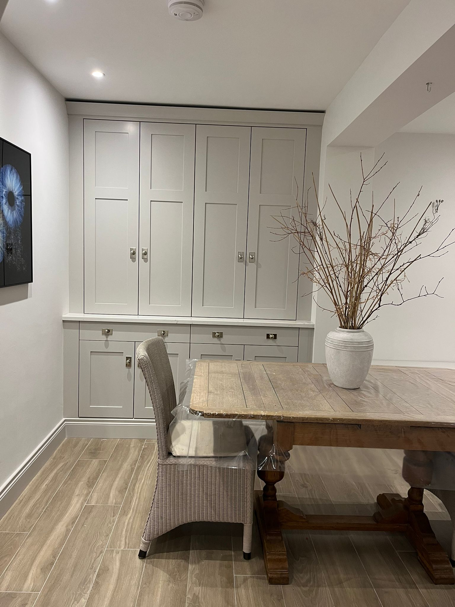 Built-in dining bench with full-height storage cabinets